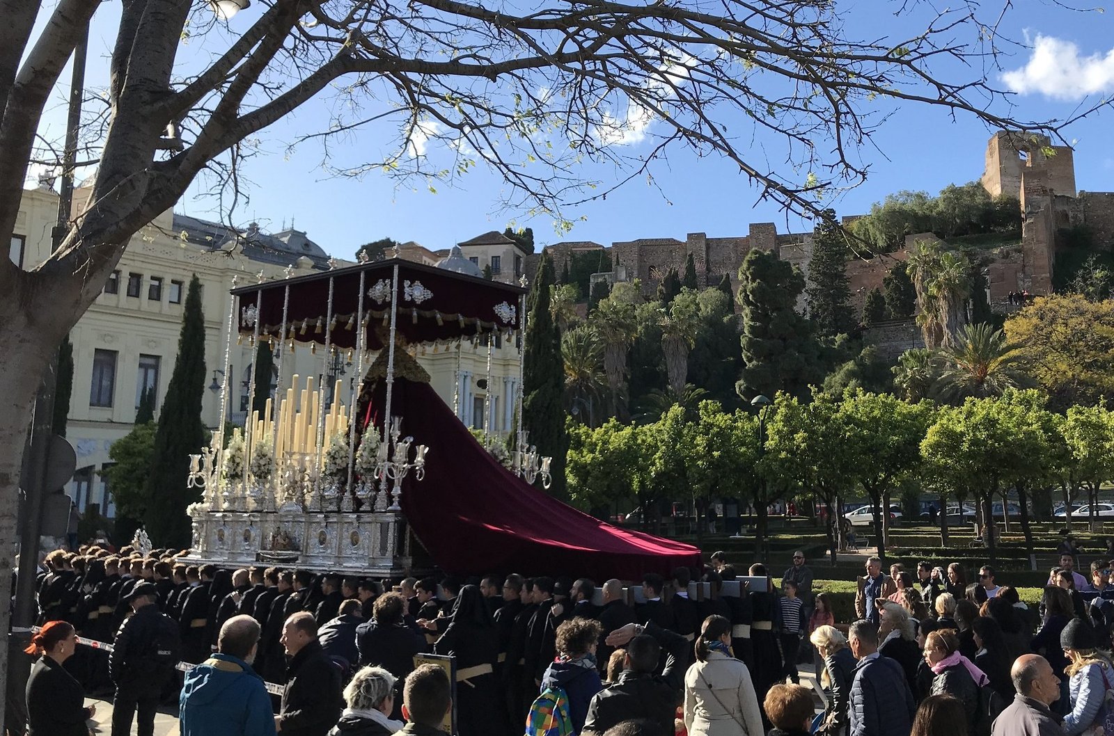 Semana Santa trono in front of Malaga City Hall during Holy Week procession.