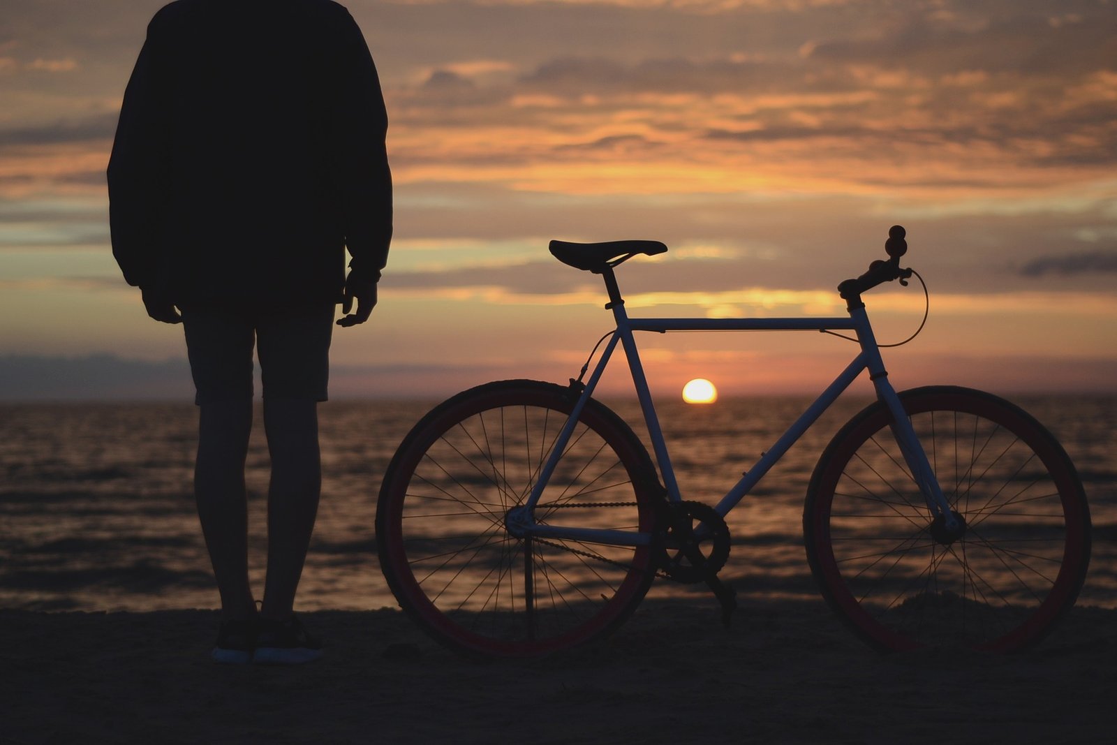 Bicycle by the sea at sunset in Malaga, southern Spain.
