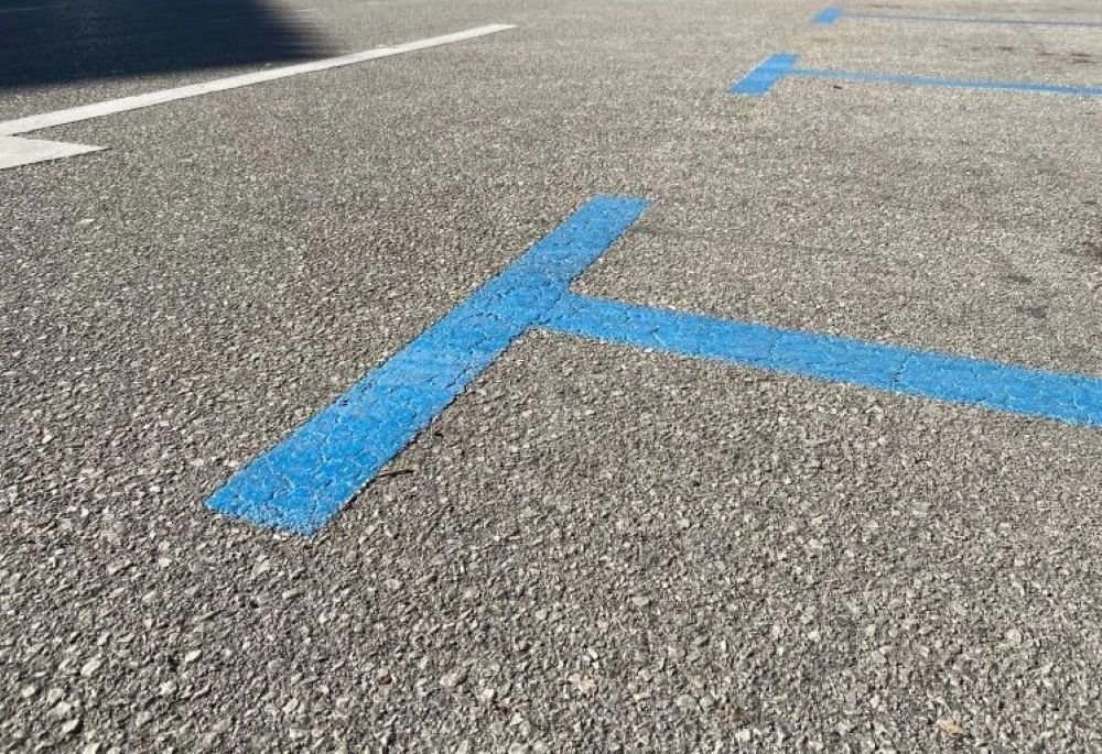 Blue zone parking markings on a street in Malaga city centre.