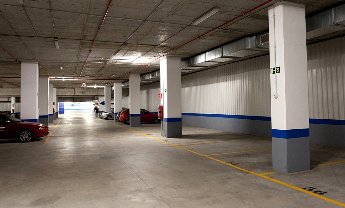 Underground public car park in Malaga city centre with marked bays.