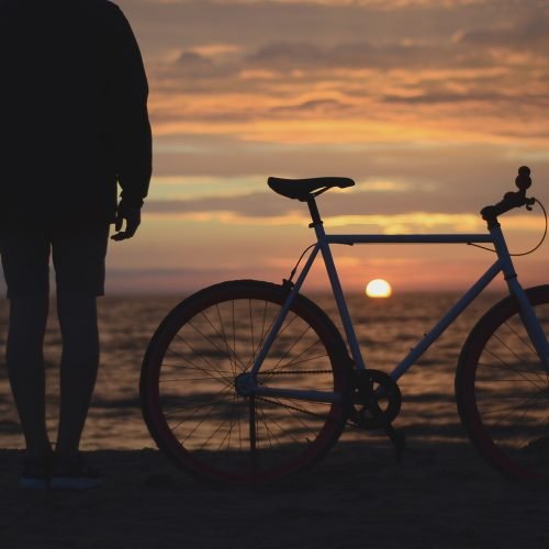 Bicycle by the sea at sunset in Malaga, southern Spain.