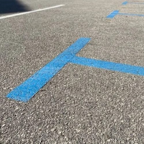 Blue zone parking markings on a street in Malaga city centre.